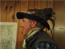 One of my scarves and my hat which is full of feathers I've found and collected